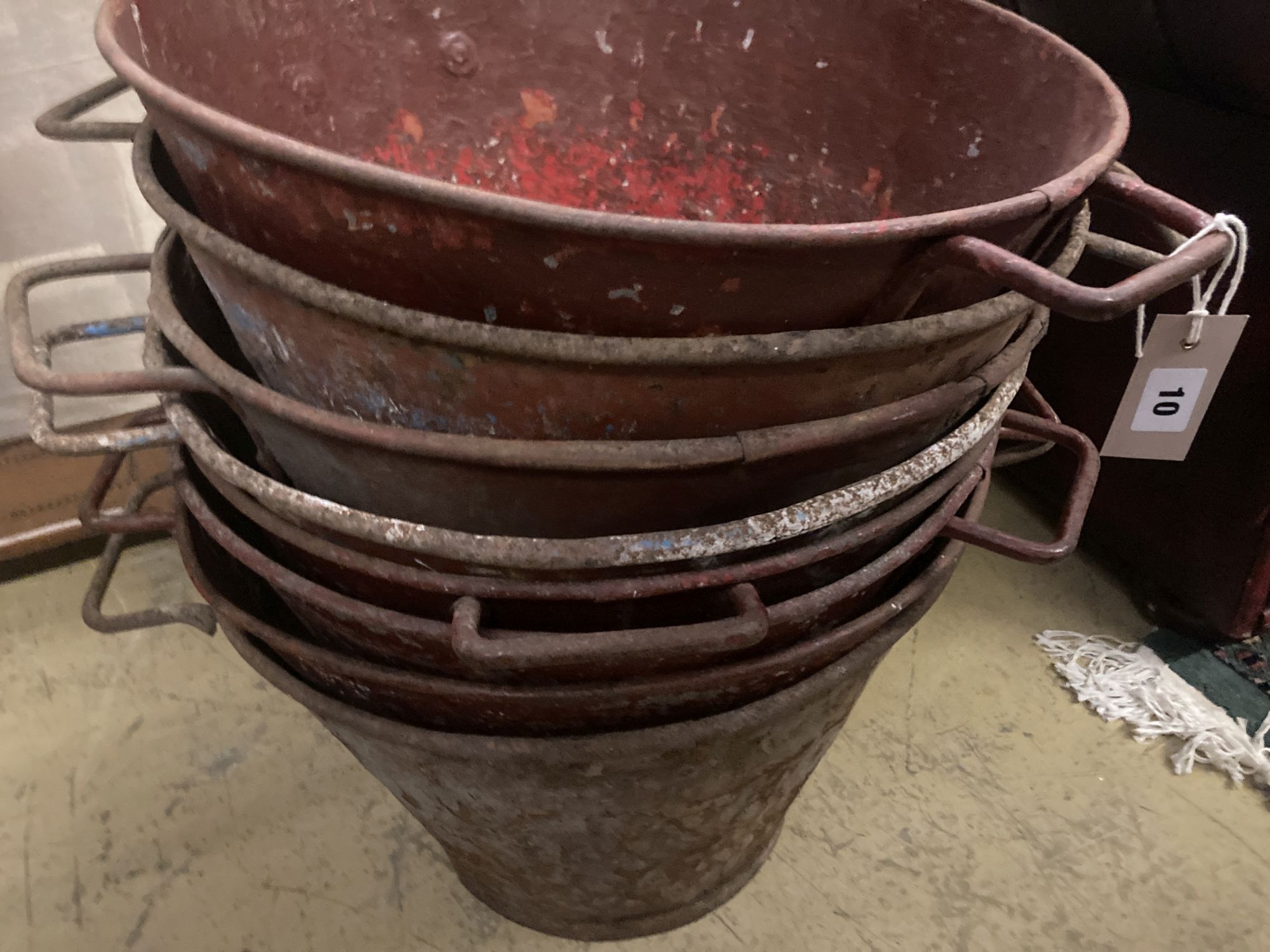 Eight early painted metal florist buckets, diameter 48cm height 36cm